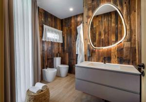 a bathroom with a sink and a mirror at Tresort Oil Glamping in Principina Terra +19 photos