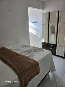 Giường trong phòng chung tại Pousada Tereza