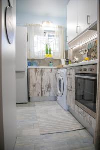 Kuchyň nebo kuchyňský kout v ubytování Homeyfeel Stay Sea 2 - Island mood studio