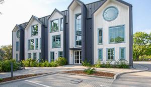 a building with a clock on the side of it at Keila Round View Apartment in Keyla