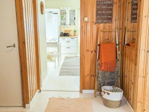 a kitchen with a door leading into a kitchen with a counter at A little home in Lahti +36 photos
