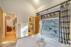 a bedroom with a bed and a large window at 2 Bed in Farnham oc-t34459 in Farnham