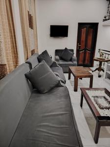 a living room with a couch and a table at Charlotte Inn in Kandy