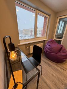 a room with a desk and a chair and a window at Apartment near the sea-Sigulda street in Liepāja