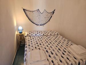 En eller flere senge i et værelse på Il Borgo delle fragoline