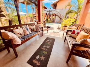 Khu vực ghế ngồi tại Pousada Vila dos Corais - Taipu de Fora