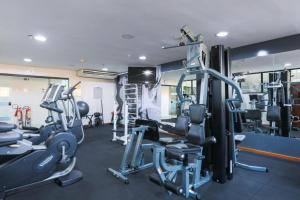 a gym with several treadmills and weights at Flat Radisson Hotel Belem in Belém