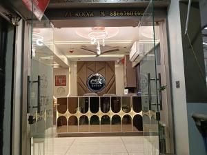 a window of a store with a display of cosmetics at Hotel THE Vibes in Koba
