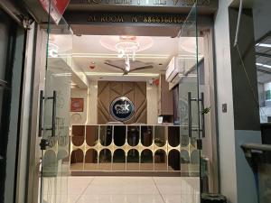 a window of a store with a wine rack at Hotel THE Vibes in Koba