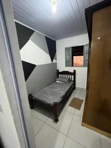 En eller flere senge i et værelse på Chácara Ouro de Mina