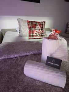 En eller flere senge i et værelse på Locazione turistica via Aurelio Saffi 5