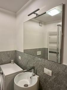 a bathroom with a sink and a mirror at Chalet Ski Home - Madesimo in Madesimo