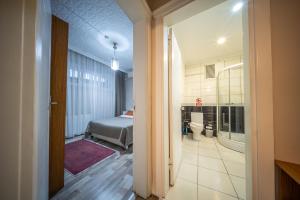 a view of a bedroom with a bed and a bathroom at Feyza Apart in Istanbul +89 photos