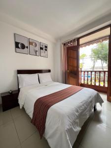 Postel nebo postele na pokoji v ubytování Tintaya Hotel Chachapoyas
