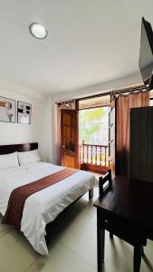 Postel nebo postele na pokoji v ubytování Tintaya Hotel Chachapoyas + 52 fotografií