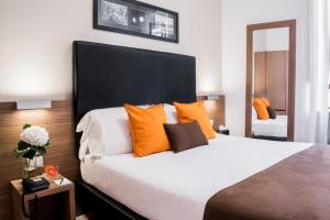 Letto o letti in una camera di Hotel Concordia