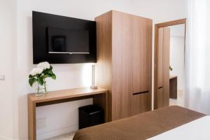 Letto o letti in una camera di Hotel Concordia