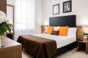 Letto o letti in una camera di Hotel Concordia