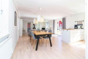a kitchen and dining room with a table and chairs at VAR949-Hagfors-Knoaende-11 in Hagfors +17 photos