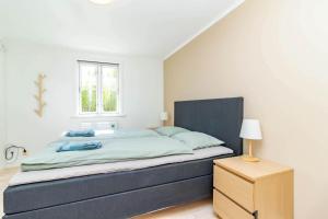 a bedroom with a large bed and a window at VAR949-Hagfors-Knoaende-11 in Hagfors