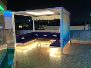 a living room with a couch and an umbrella at The Sun Gate in Agadir