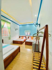 Postel nebo postele na pokoji v ubytování Trúc Nguyên - Vĩnh Hy Homestay