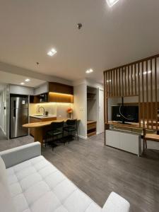 a kitchen and living room with a table and chairs at Lobie Botafogo Privilege in Rio de Janeiro