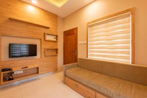 Et tv og/eller underholdning på Daan Ambalath Maple Leaves