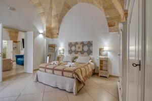 a bedroom with a large bed in a room at Volta Apartment in Mesagne