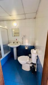 a bathroom with a toilet and a sink at Quadruple Room 3629 in St. Paul's Bay +22 photos