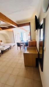 a living room with a couch and a table at Quadruple Room 3629 in St. Paul's Bay