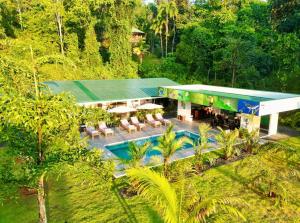 an aerial view of a house with a swimming pool at Luxury Apartments Nauyaca by Paradiselodge in Platanillo