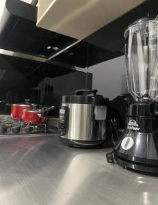 a blender sitting on top of a kitchen counter at Apartamentos con aire acondicionado SAN LUIS in San Luis