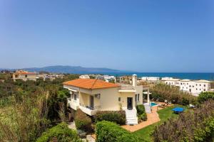 a villa with a view of the ocean at Villa Aggeliki by Villa Plus in Pírgos Psilonérou