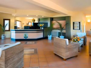 a large living room with a couch and chairs at Aura Club Porto Rhoca in Squillace +17 photos