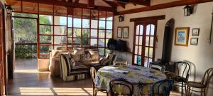 a living room with a couch and a table at Casa Dique Cabra Corral in Coronel Moldes