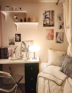 a bedroom with a desk and a bed with a bed sidx sidx sidx at Bomnal Stay 봄날스테이 in Samgong