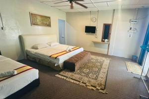 En eller flere senge i et værelse på Green Town Hotels and Resorts + 51 billeder