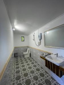 a bathroom with a sink and a toilet at Real Hostel in Koh Rong Island