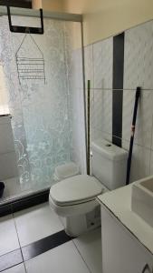 a bathroom with a toilet and a sink at Plaza murillo in La Paz