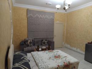 Giường trong phòng chung tại DIAMANTE Al Ain