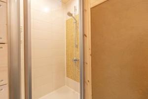 a bathroom with a shower with a glass door at KRO845-Lessebo-Vedamala-14 in Ljuder