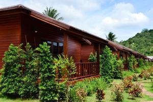 a wooden house with trees in front of it at PingChan Koh Phangan Beachfront Resort in Thong Nai Pan Yai