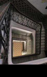a stair case with a grate on top of it at Pension Gibraltar in Tangier +38 photos