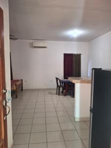 a room with a kitchen and a table and a refrigerator at Casa Nicañol in La Virgen