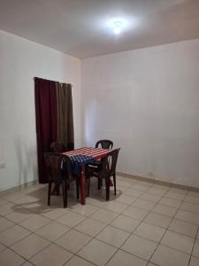 a dining room with a table and four chairs at Casa Nicañol in La Virgen +4 photos
