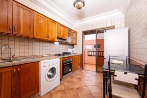 a kitchen with a refrigerator and a dishwasher at L'hivernage andalouse 4 in Marrakesh
