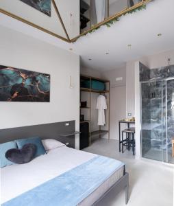 En eller flere senge i et værelse på Ladi House