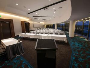 a conference room with tables and chairs in it at Mantra Twin Towns in Tweed Heads