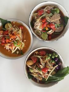 three bowls of food sitting on a table at Tanya's Cafe & Resort in Ban Kasang +9 photos